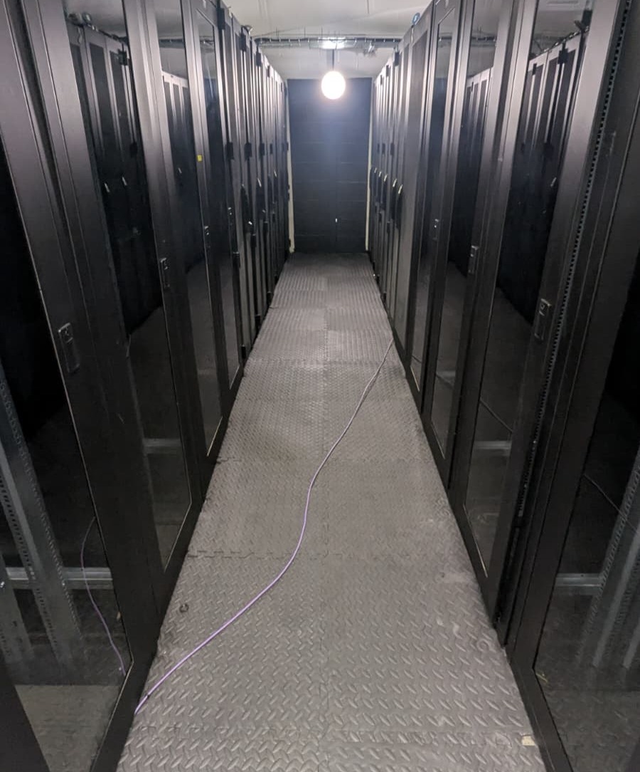 Cold aisle between private rack rows at the NorwichDC facility